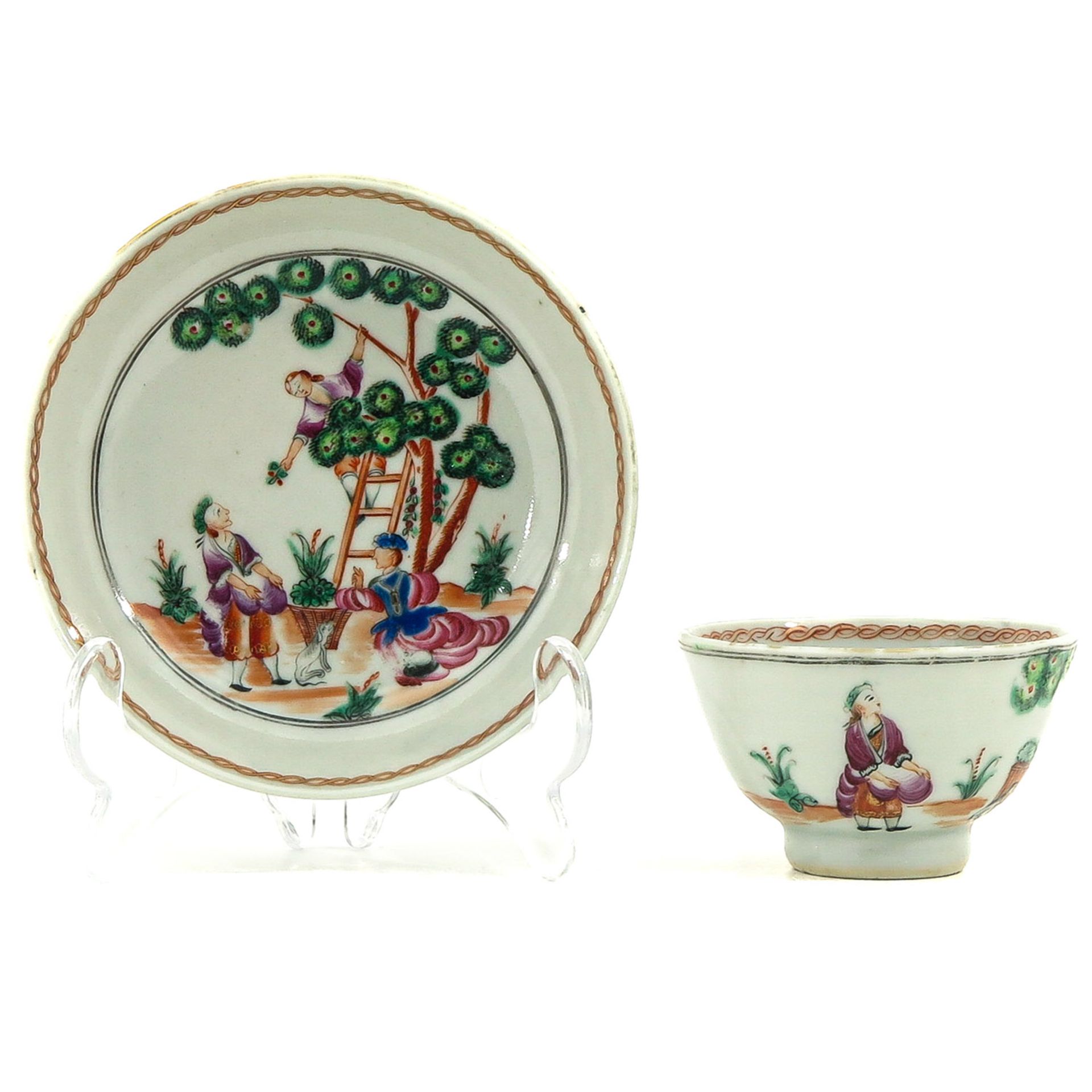 A Cherry Pickers Decor Cup and Saucer