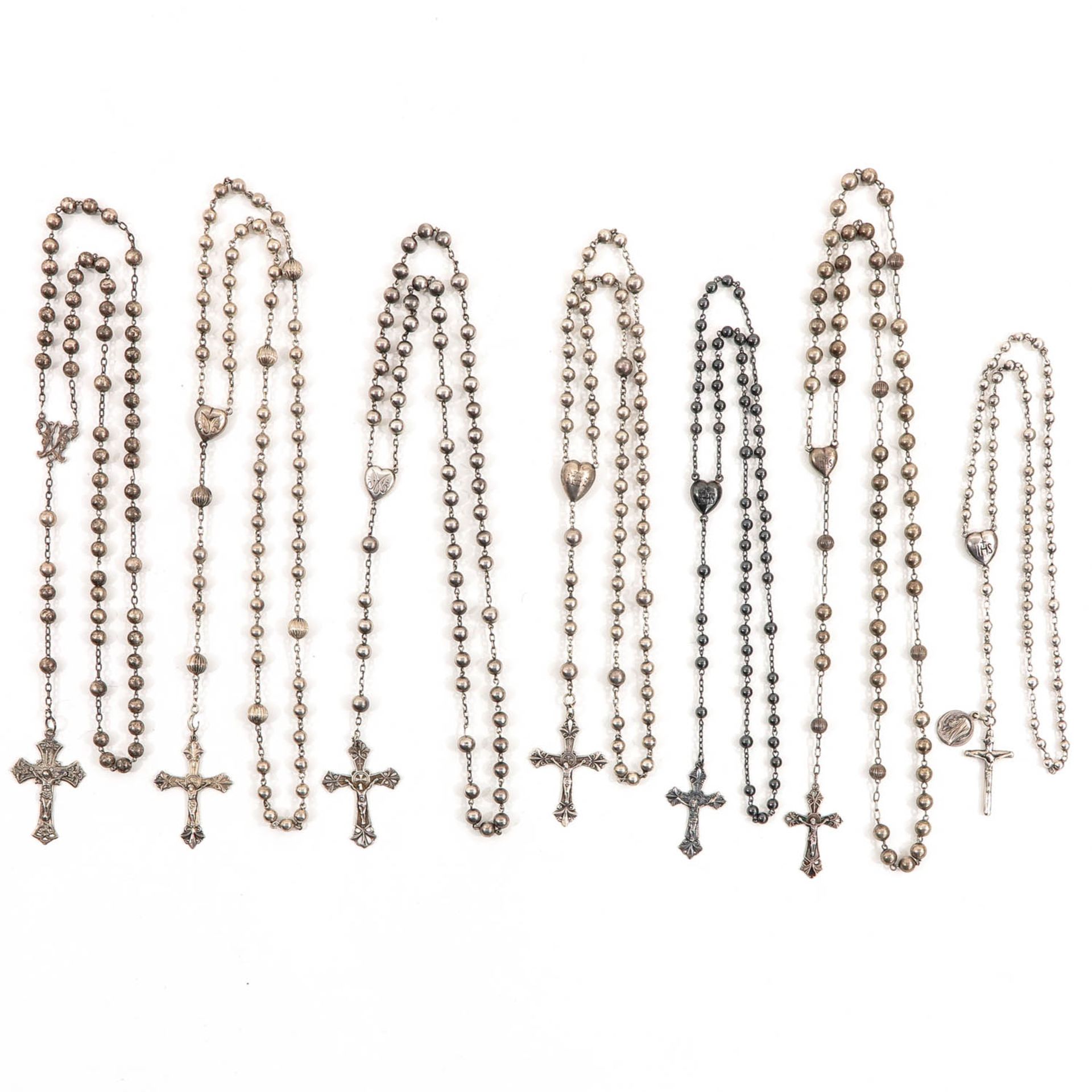 A Collection of 7 Silver Rosaries