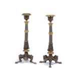 A pair of Regency style candlesticks