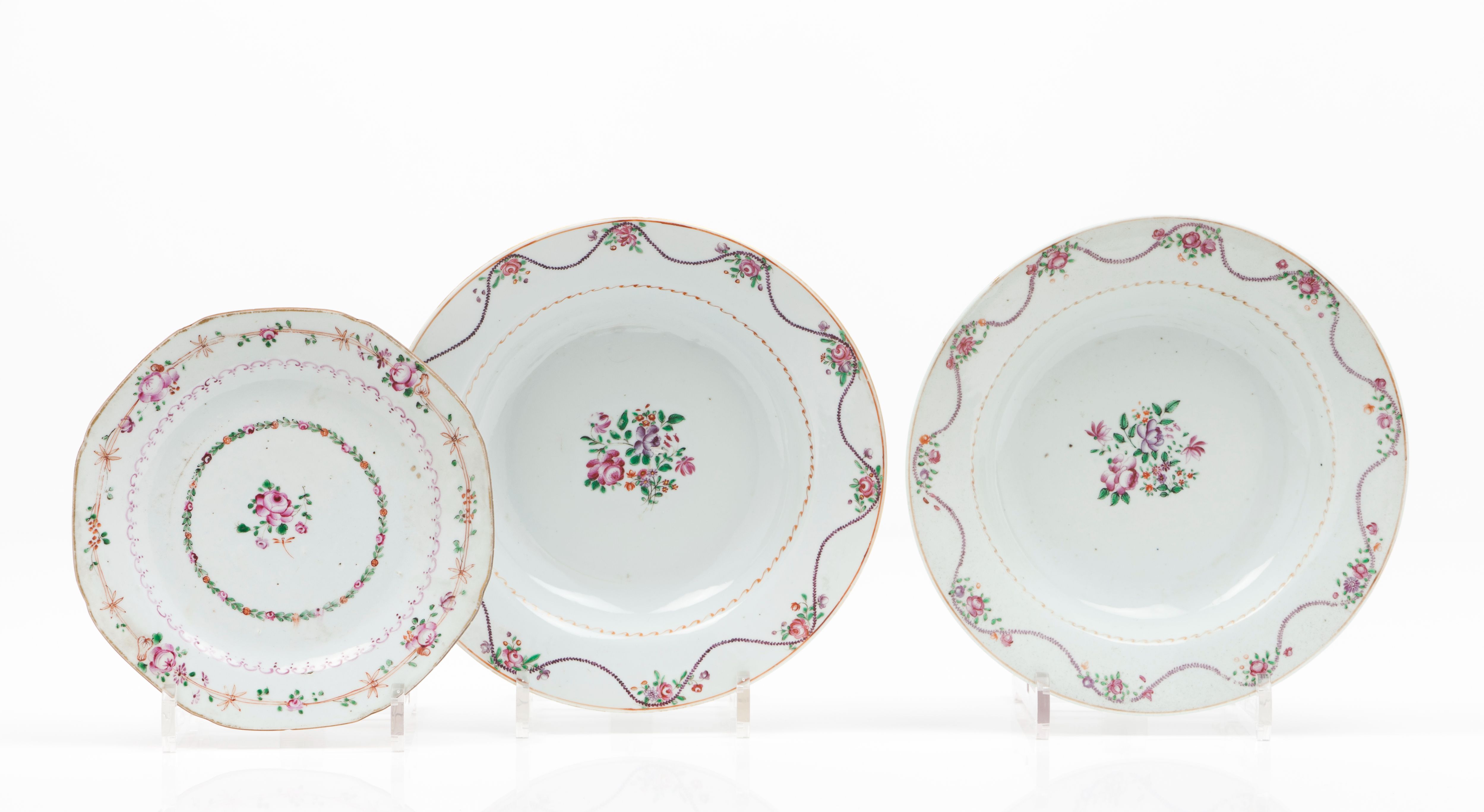 A set of saucers and a pair of deep plates