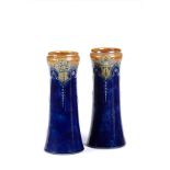 A pair of Royal Doulton beaker vases