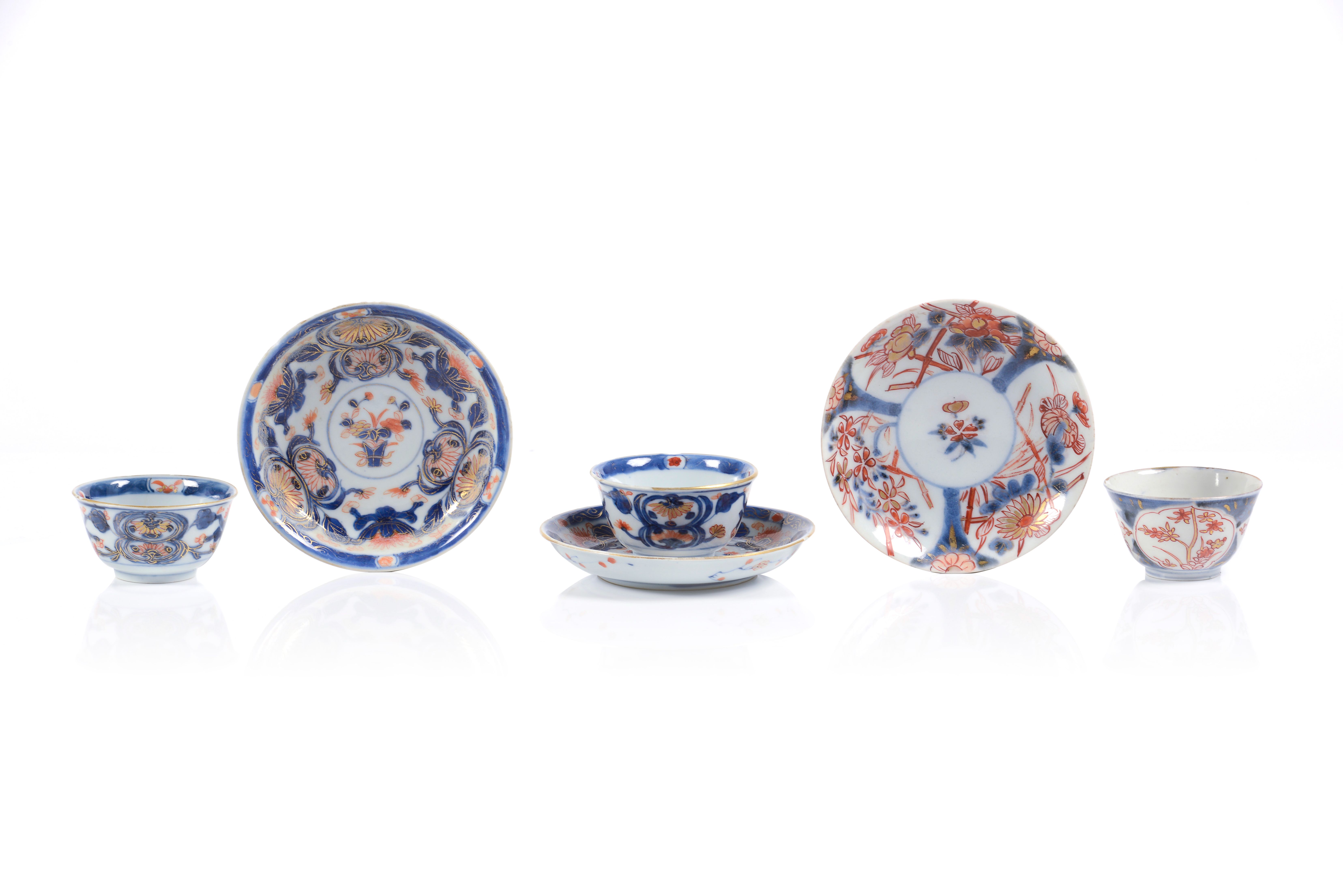 A set of three Imari cups and saucers