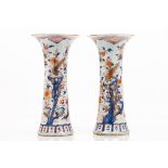 A pair of large Imari beaker vases