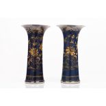 A pair of beaker vases