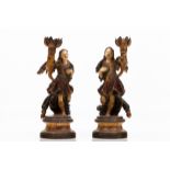 A pair of seraphs candle holders