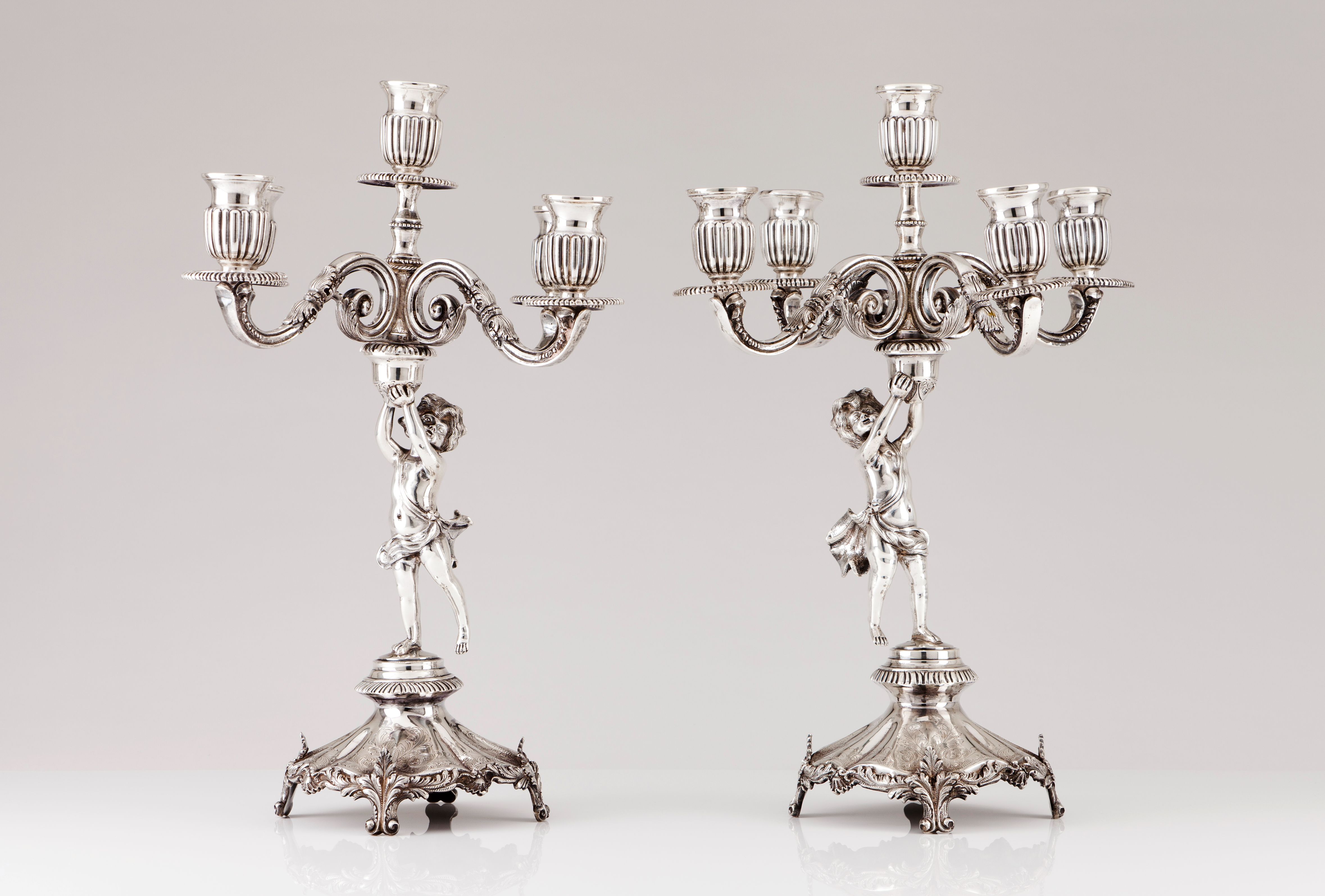 A pair of five branch candelabra