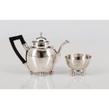 A neoclassical teapot and drip bowl