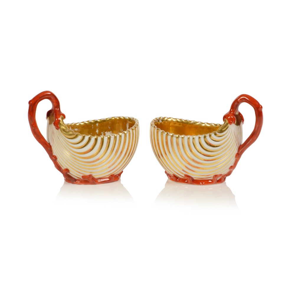 A pair of shell shaped cups