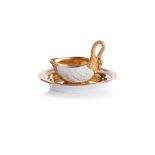 A swan shaped cup and saucer