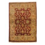 A Ziegler rug, Iran, Wool and cotton of floral pattern in beige, green and bordeaux shades,