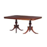 An English style dining table, Brazilian mahogany, resting on two shafts, Curved legs on metal