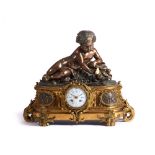 A Napoleon III tabletop clock, Patinated and gilt bronze, Surmounted by putto, Foliage reliefs and