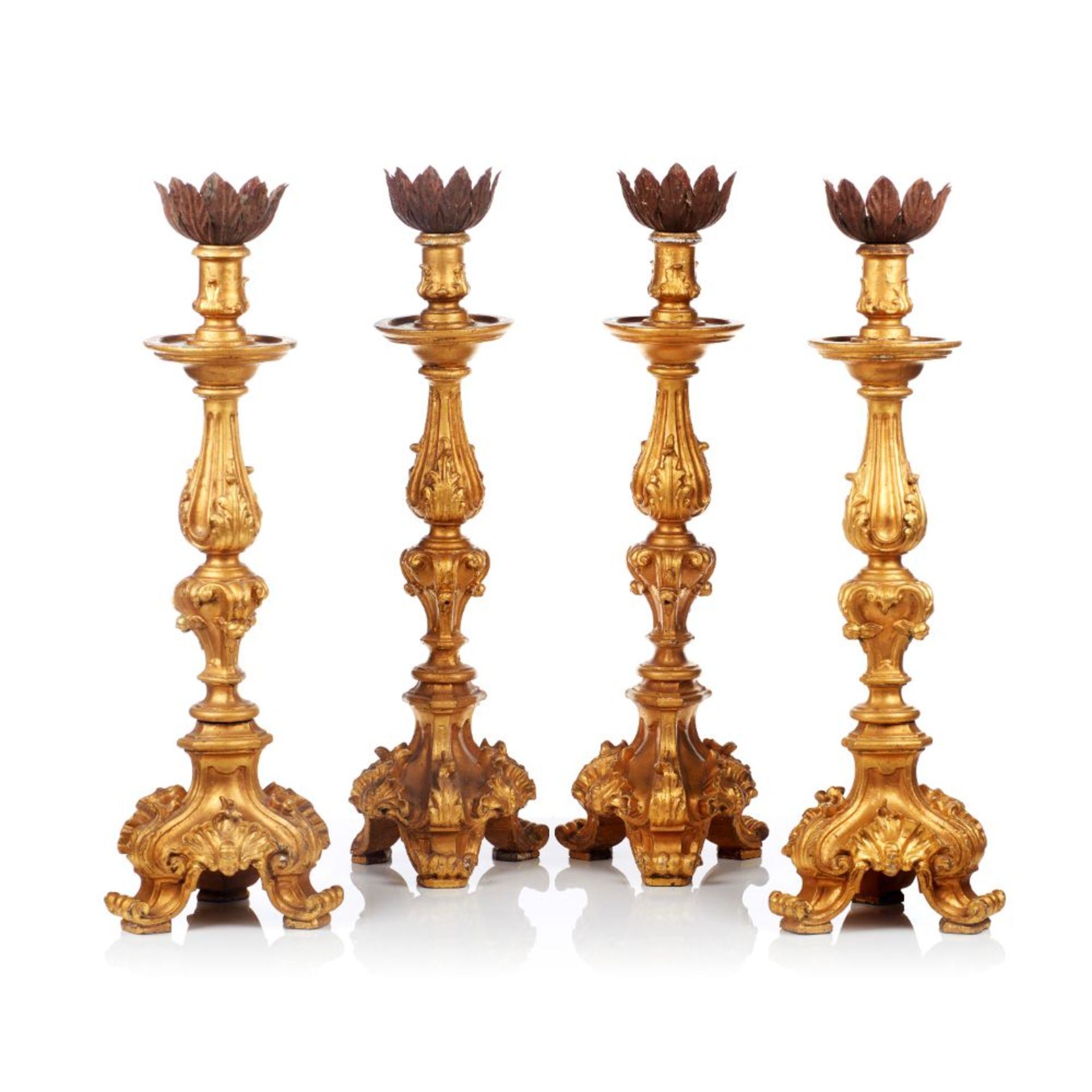 A set of four D.José style large candleholders, Carved, painted and gilt wood, Portugal, 20th