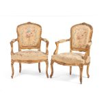 A pair of Louis XV style fauteuils, Carved and gilt wood, Floral and foliage motifs tapestry