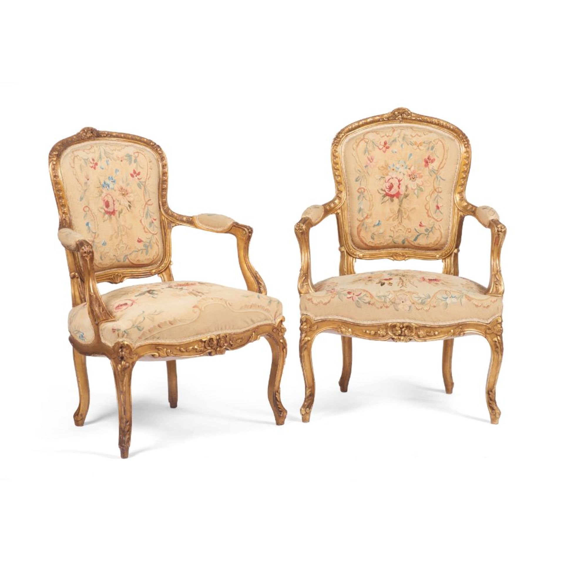 A pair of Louis XV style fauteuils, Carved and gilt wood, Floral and foliage motifs tapestry