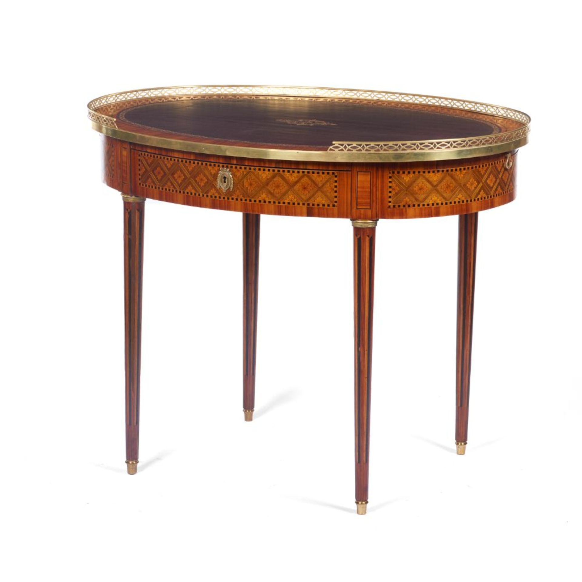 A Louis XVI style oval lady's desk, Rosewood veneered of satinwood, jacaranda, rosewood and other