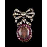 A bow shaped brooch with pendant / reliquary, Silver, Set with garnets and chrysoberyl's, Wooden