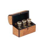 A three perfume bottles etui, Burr wood veneered case, Three crystal bottles of painted and gilt