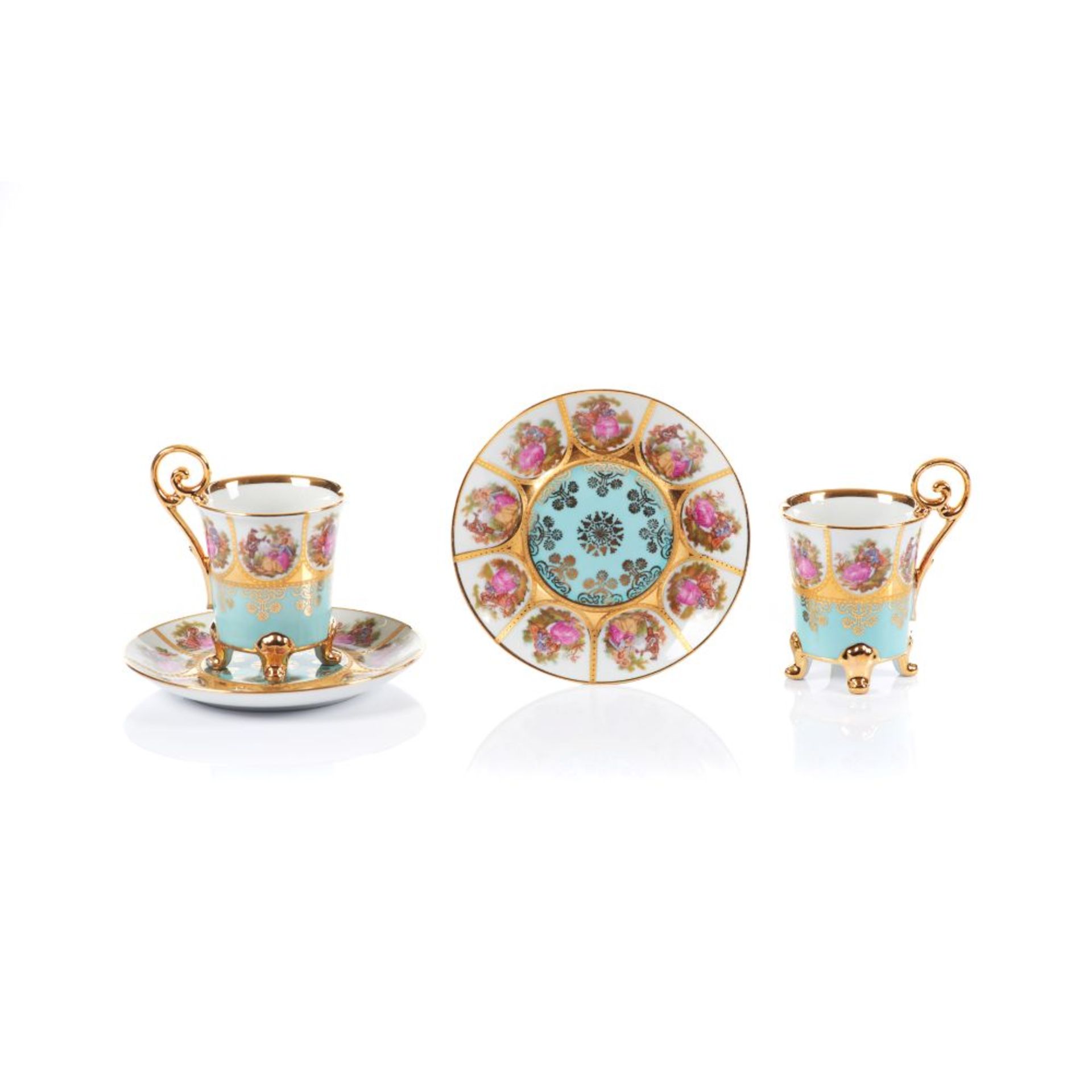 A pair of Empire style cups and saucers, European porcelain, Polychrome and gilt decoration of