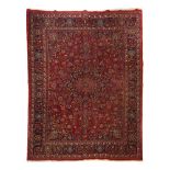 A Mashad rug, Iran, Wool and cotton of floral and geometric pattern in bordeaux, blue and beige