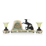 An Art Deco garniture, Comprising of a clock and pair of candlesticks, Marble and onyx, Clock with