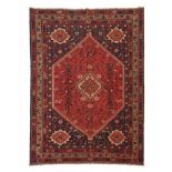 A Shiraz rug, Iran, Wool and cotton of geometric pattern in bordeaux and beige shades, 300x220 cm