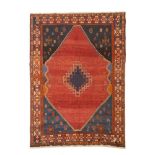 A Kashkai rug, Iran, Wool and cotton of geometric pattern in bordeaux, blue and beige shades,