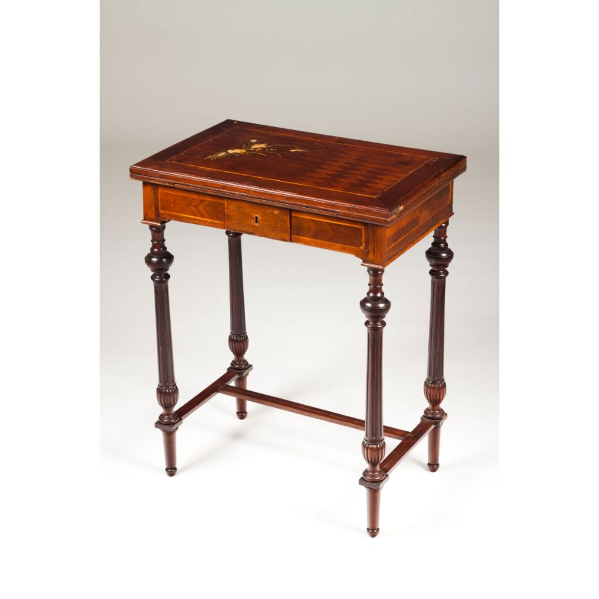 A small Napoleon III card table, Mahogany, With two tops, one green lined and the other with leather