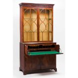 A chest of drawers / Secretaire with bookcase, Solid and veneered mahogany, Two doors and secretaire