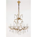 An eleven branch chandelier, Metal, glass and crystal, Height: 90 cm, Diam.: 84 cm