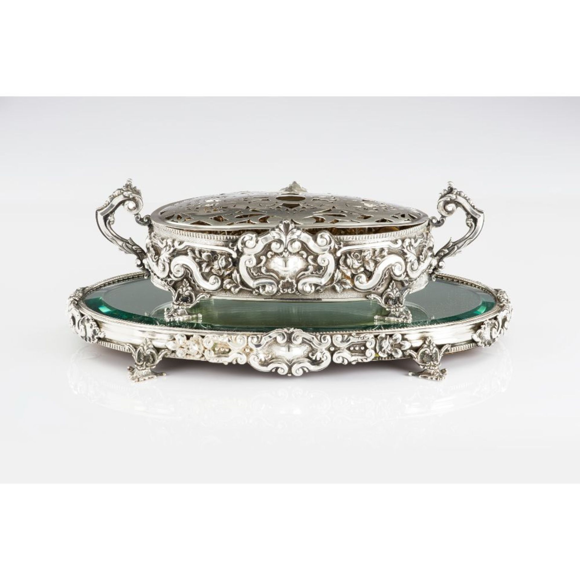 A centrepiece / flower holder, Silver 833/000, Foliage and cartouches reliefs decoration, Bevelled