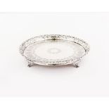 A four footed galleried salver, Silver 833/000, Vines and grapes motifs decoration to gallery,