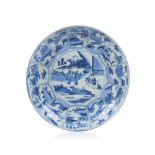 A large plate, Chinese porcelain, Blue underglaze decoration of landscapes with figures, Ming
