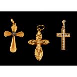 A group of three cross shaped pendants, Gold 800/000 and silver 833/000, Set with pearls and