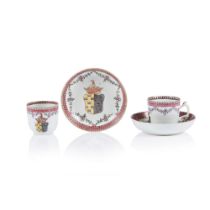 Par of armorial cups and saucers