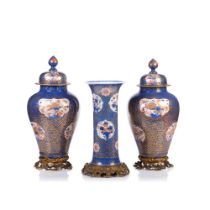 A pair of Imari covered vases and beaker vase