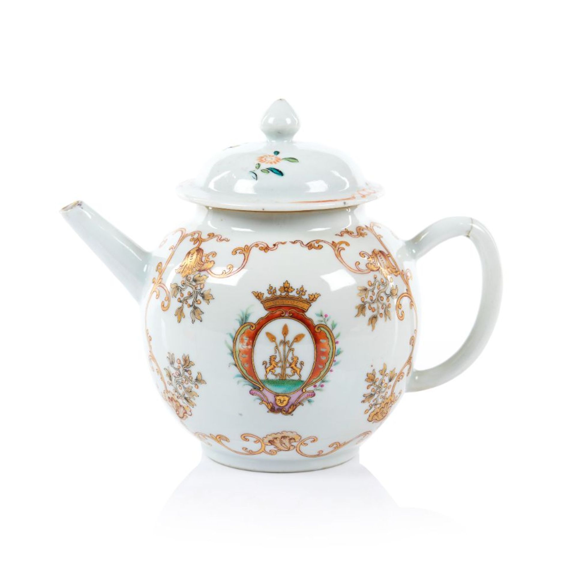 An armorial teapot and cover