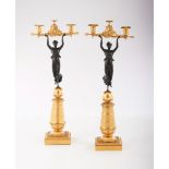 A pair of "Directoire" style two branch candelabra