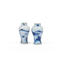 A pair of blue and white miniature vases