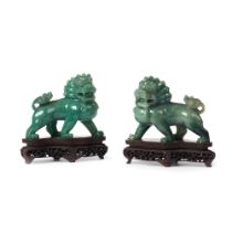 A pair of carved green stone lions
