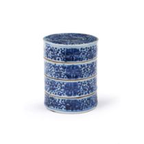 A blue and white stackable food container and cover