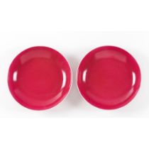 A pair of 'ruby-pink' monochrome enamelled dishes