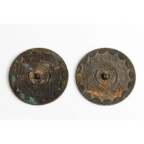 A pair of bronze mirrors