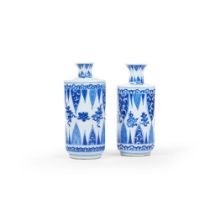 A pair of small blue and white bottle vases