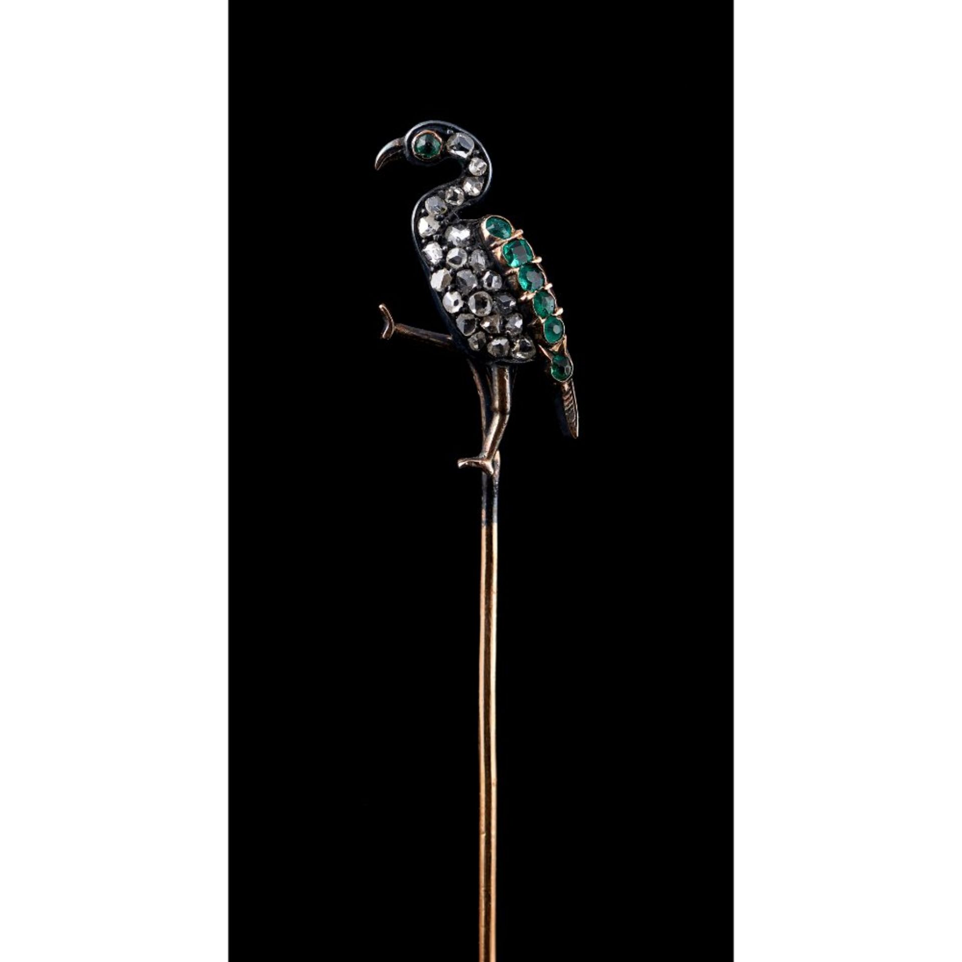 A long legged bird tie pin