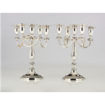 A pair of five branch candelabra