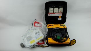 Medtronic Lifepak 1000 Defibrillator With Case, Battery, Various Pads, Used.