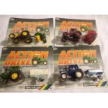 Four Britians action drive tractor and implement set in blister packs in excellent to mint