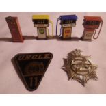 Man from uncle no11 badge plus Z cars badge, also three vintage petrol pumps and a Hornby O gauge