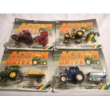 Four Britains action drive tractor and implement set in blister packs in excellent to near mint